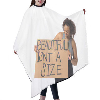 Personality  Biracial Young Female Plus Size Model Holds Poster On A White Background. She Has Curly Hair, A Fit Build, Wears A Tank Top And Leggings, And Promotes Body Positivity, Unaltered Hair Cutting Cape