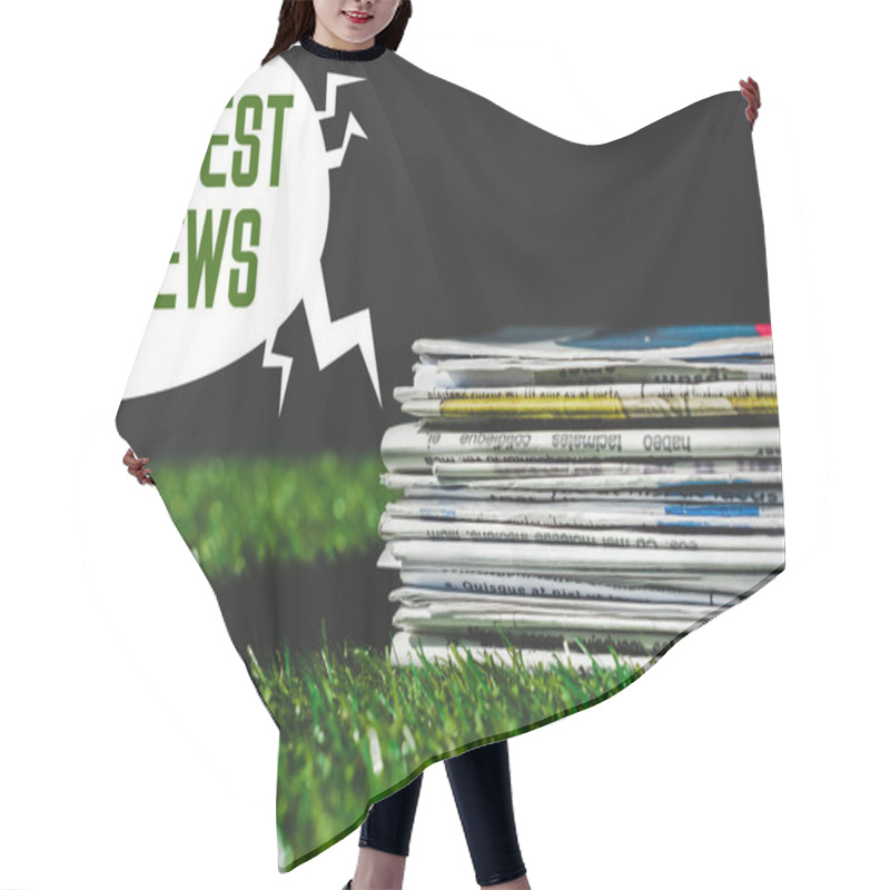 Personality  Stack Of Different Print Newspapers On Fresh Green Grass Near Speech Bubble With Green Latest News Lettering Isolated On Black Hair Cutting Cape