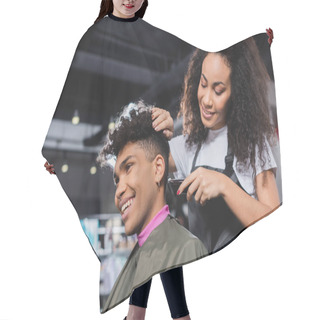 Personality  Smiling African American Hairdresser In Apron Trimming Neck Of Client In Salon  Hair Cutting Cape