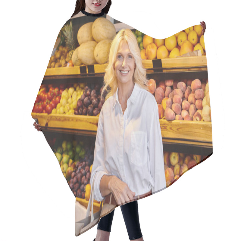 Personality  Cheerful Mature Woman With Shopping Bag Smiling Happily At Camera With Grocery Stall On Backdrop Hair Cutting Cape