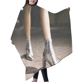 Personality  Cropped Shot Of Woman In Glossy Silver Boots Walking On Street At Night Hair Cutting Cape