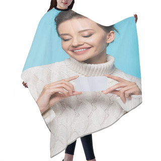 Personality  Smiling Model In White Sweater Holding Blank Card Isolated On Blue Hair Cutting Cape