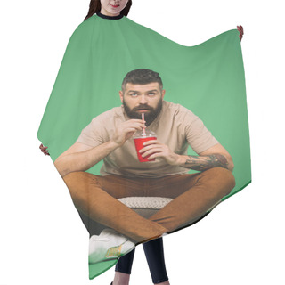 Personality  Interested Handsome Bearded Man Drinking Soda On Green Hair Cutting Cape