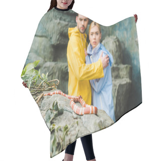 Personality  Scared Young Couple In Raincoats Terrified Of Snake On Rock Hair Cutting Cape