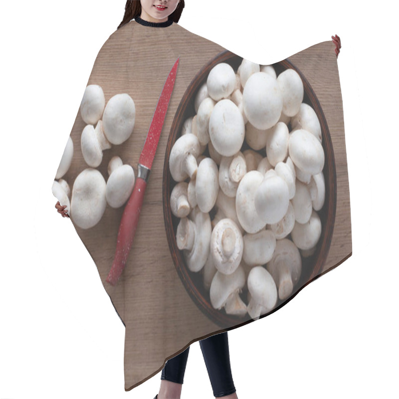 Personality  Fresh Champignons On The Table, In A Bowl And On A Wooden Board With A Red Knife, Top View Of Vegetable Ingredients For Cooking. Hair Cutting Cape