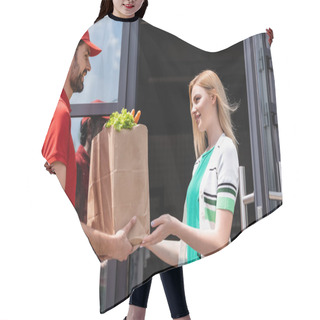 Personality  Smiling Courier Giving Shopping Bag With Vegetables To Young Woman Near Building On Urban Street  Hair Cutting Cape