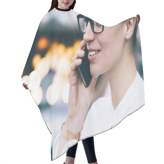 Personality  Cropped Side View Of Positive Hipster Girl Laughing While Calling On Smartphone And Talking In Roaming On Bokeh Background.Cheerful Young Woman In Stylish Eyeglasses Communicating On Cellular Hair Cutting Cape