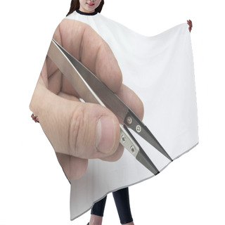 Personality  Hand Holding A Pair Of Tweezers. Hair Cutting Cape