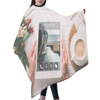 Personality  Partial View Of Woman Holding Tablet With Tickets Website On Screen At Surface With Cup Of Coffee And Bouquet Of Flowers Hair Cutting Cape