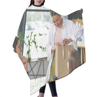 Personality  Young And Pleased African American Woman Looking In Shopping Bag Near Multicultural Girlfriends Spending Time In Cozy Atmosphere Of Women Interest Club, Sharing Joy And Positive Emotions  Hair Cutting Cape