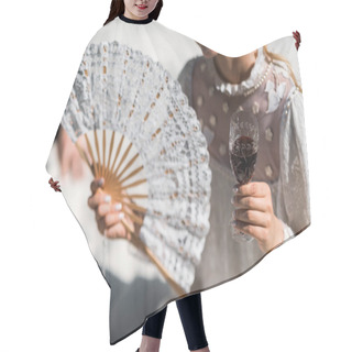 Personality  Cropped View Of Happy Young Victorian Woman Holding Fan And Wine Glass  Hair Cutting Cape
