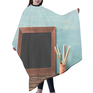 Personality  Empty Chalkboard Near Pencils On Wooden Table Near Blue Wall Hair Cutting Cape