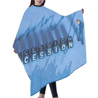 Personality  Low Key Selective Focus Miniature Figurine And Word Block 'Recession' Concept With Out Of Focus Downward Chart In The Background. Intentional Long Shadow . Hair Cutting Cape