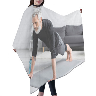 Personality  Tattooed Man With Grey Hair Doing Plank On Fitness Mat Near Dumbbells And Sports Bottle In Living Room Hair Cutting Cape