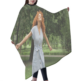 Personality  Pleased Young Woman With Red Hair Standing With Outstretched Hands In Green Park  Hair Cutting Cape