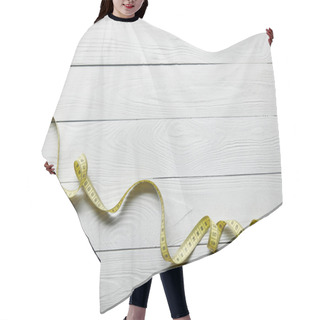 Personality  Top View Yellow Measuring Tape On Wooden White Background With Copy Space Hair Cutting Cape