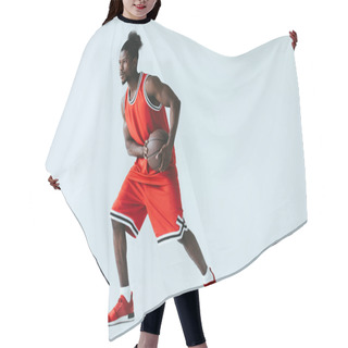 Personality  African American Basketball Player In Red Sportswear Holding Ball On Grey Background Hair Cutting Cape