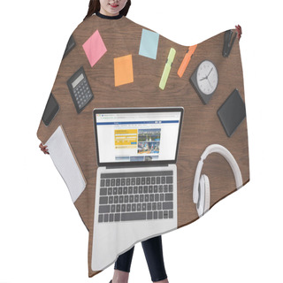 Personality  Top View Of Wooden Table With Empty Textbook, Smartphone, Photo Camera And Laptop With Booking.com On Screen Hair Cutting Cape