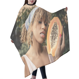 Personality  Portrait Of Trendy Young African American Woman In Headscarf And Summer Outfit Holding Cut And Ripe Papaya While Standing In Blurred Garden Center, Stylish Lady Blending Fashion And Nature Hair Cutting Cape