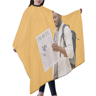 Personality  Cheerful African American Man Standing With Backpack And Reading Travel Newspaper Isolated On Orange Hair Cutting Cape