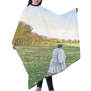 Personality  Back View Of African American Woman In Trench Coat Walking On Grass With Golden Leaves, Autumn Park Hair Cutting Cape