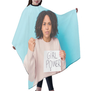 Personality  Young African American Mixed Race Woman Holding A Girl Power Concept Showing Fist To Camera, Aggressive Facial Expression. Hair Cutting Cape