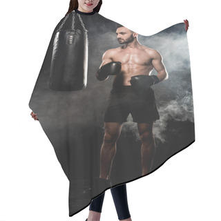 Personality  Thoughtful Sportsman In Boxing Gloves Standing Near Punching Bag On Black With Smoke Hair Cutting Cape