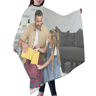 Personality  Smiling Father Helping Little Daughter Packing Backpack For First Day At School, Back To School Concept Hair Cutting Cape