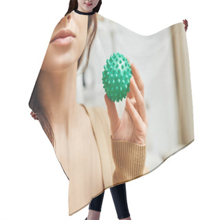 Personality  Cropped View Of Young Brunette Woman In Jumper Holding Manual Massage Ball While Standing In Blurred Living Room At Home, Lymphatic System Support And Home-based Massage, Tension Relief Hair Cutting Cape