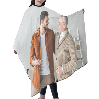 Personality  Handsome Man Gesturing And Looking At Cheerful Senior Father  Hair Cutting Cape