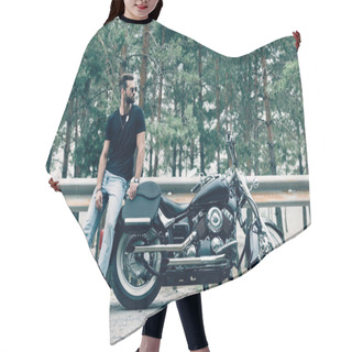 Personality  Handsome Motorcyclist In Sunglasses Standing Near Black Motorcycle On Road Near Green Forest Hair Cutting Cape