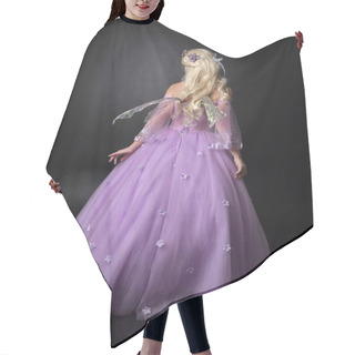 Personality  Full Length Portrait Of A Blonde Girl Wearing A Fantasy Fairy Inspired Costume,  Long Purple Ball Gown With Fairy Wings,   Standing Pose  With Back To The Camera On A Dark Studio Background. Hair Cutting Cape