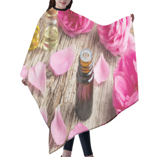 Personality  A Bottle Of Essential Oil With Fresh Roses And Petals On A Wooden Background Hair Cutting Cape