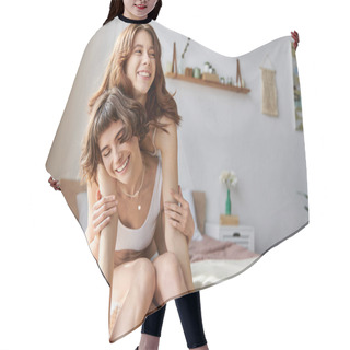 Personality  Two Women In Cozy Attire Share A Tender Moment On A Bed. Hair Cutting Cape