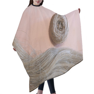 Personality  The Uncolored Flax Or Hemp And Skein On A Copper Surface. Copy Space. Top View. Hair Cutting Cape