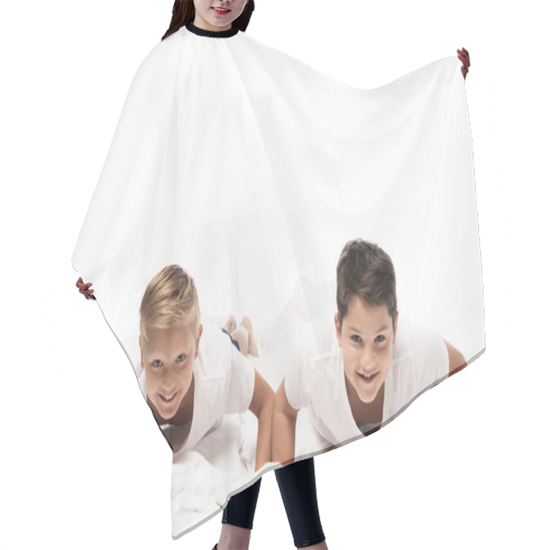 Personality  Two Cheerful Brothers Doing Push Ups On Bedding And Looking At Camera Isolated On White Hair Cutting Cape