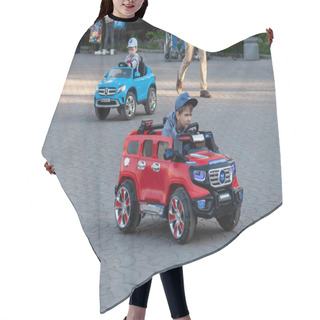 Personality  Two Little Boys Ride On Red And Blue Electric Cars While Walking Hair Cutting Cape