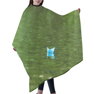 Personality  Close-up Shot Of Blue Paper Origami Boat Floating On Water Surface Hair Cutting Cape