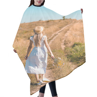 Personality  Back View Of Young Woman In White Dress And Straw Hat Holding Wildflowers While Walking On Road In Meadow Hair Cutting Cape