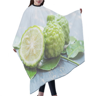 Personality  Bergamot With Green Leafs On Plywood Background. Hair Cutting Cape