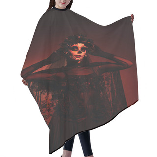 Personality  Woman In Black Costume And Santa Muerte Makeup Touching Black Wreath On Burgundy Background With Red Lighting Hair Cutting Cape