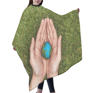 Personality  Cropped Image Of Man Holding Earth Model In Hands Above Green Grass, Earth Day Concept Hair Cutting Cape