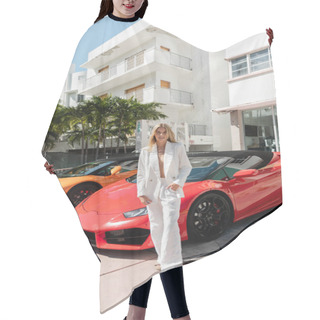 Personality  A Young Blonde Woman Standing Confidently In Front Of A Row Of Luxury Sports Cars In Miami, Exuding Elegance And Sophistication. Hair Cutting Cape
