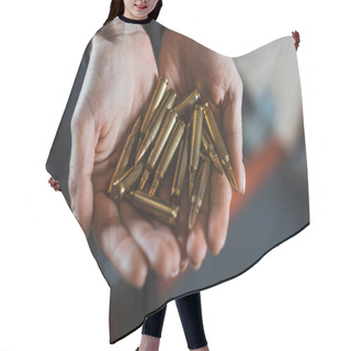 Personality  Cropped Image Of Woman Holding Bullets In Hands Hair Cutting Cape