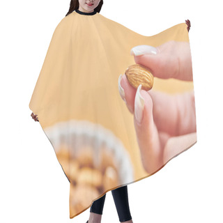 Personality  Close Up View Of Female Hand With Almond Above Bowl With Vegetarian Food On Blurred Background Hair Cutting Cape