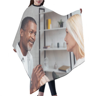Personality  Mature Woman And African American Man Holding Hands Together  Hair Cutting Cape