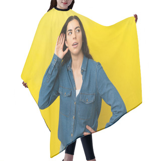 Personality  Young Caucasian Woman Isolated On Yellow Background Listening To Something By Putting Hand On The Ear Hair Cutting Cape