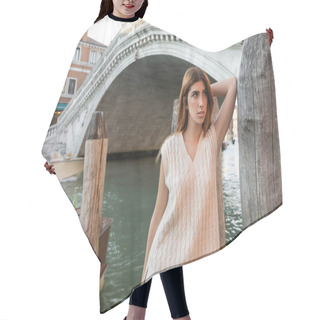 Personality  Woman In Sleeveless Shirt Leaning On Wooden Piling Near Venetian Bridge On Background Hair Cutting Cape