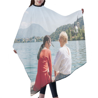 Personality  Back View Of Stylish Girls Sitting On Wooden Pier Near Tranquil Mountain Lake, Bled, Slovenia Hair Cutting Cape