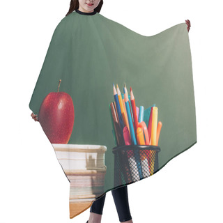 Personality  Pen Holder With Color Pencils And Felt Pens And Ripe Apple On Books Near Green Chalkboard Hair Cutting Cape